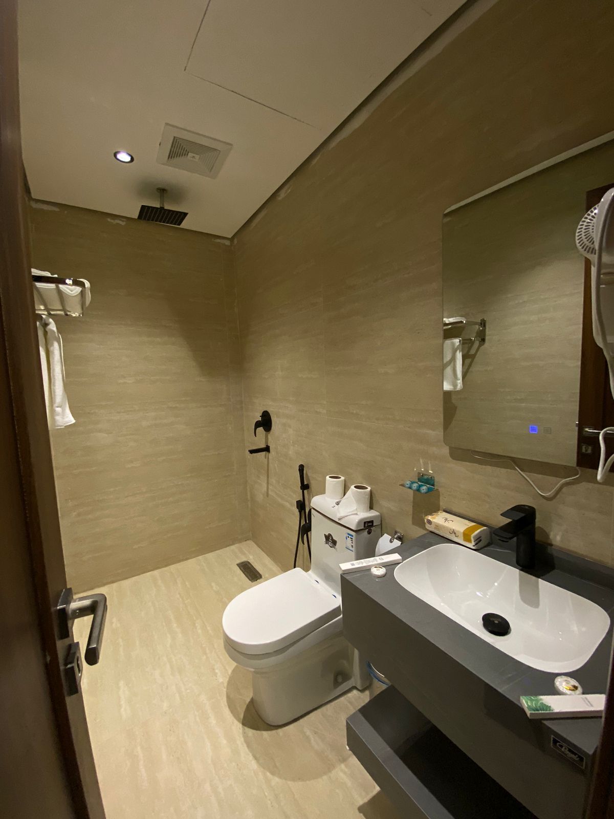 Shower, rainfall showerhead, designer toiletries, hair dryer
