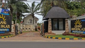 The entrance to Grand Anyerpalaza Boutique Resort with a clear pathway leading to the main building. - Nemuru Grand Anyer Palazo (Anyer)