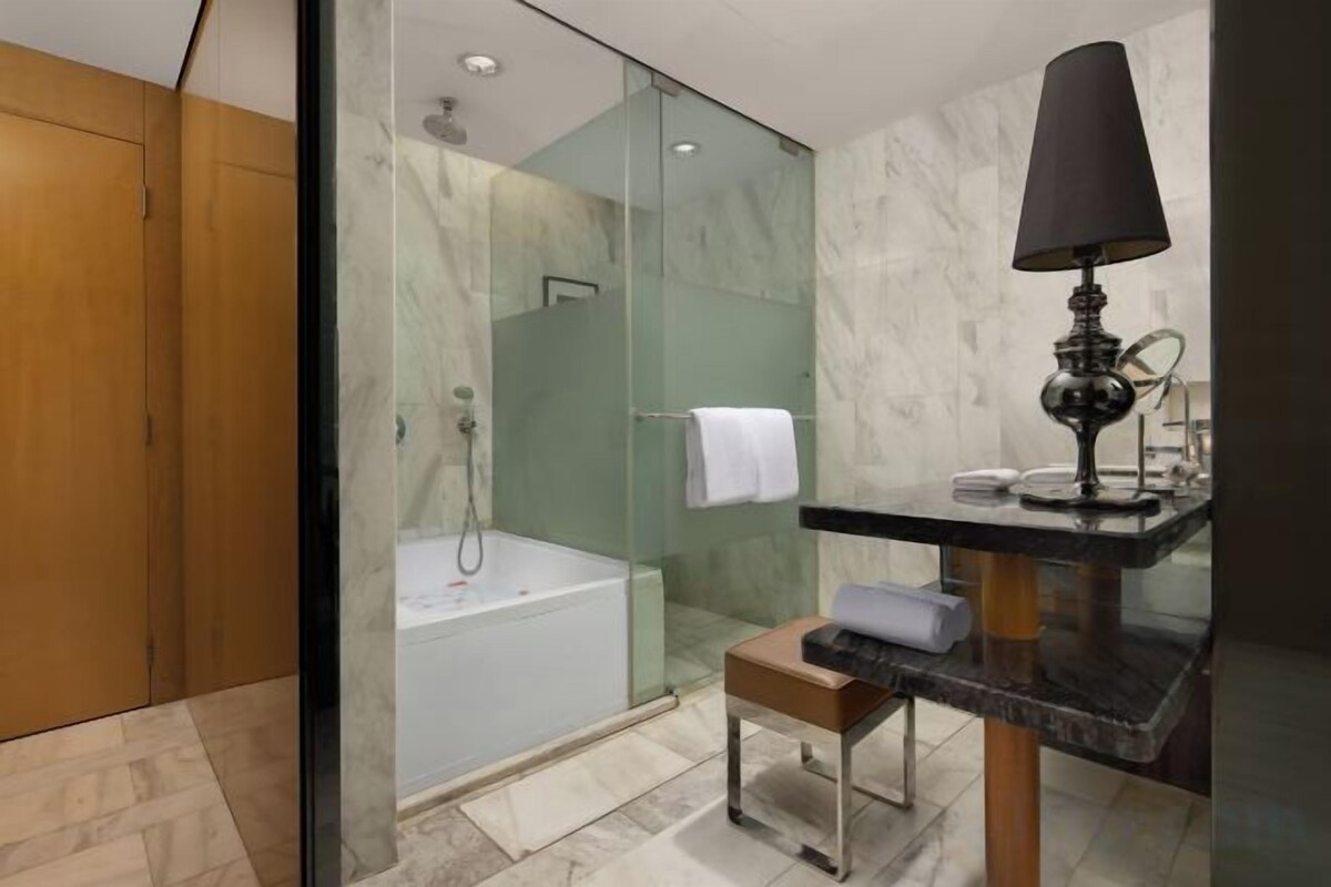 Bathroom | Separate bathtub and shower, hair dryer, slippers, towels