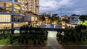 A modern hotel with multiple floors, a rooftop pool, and well-maintained gardens. - Nemuru Grand Bhuvana Ciawi (Ciawi)