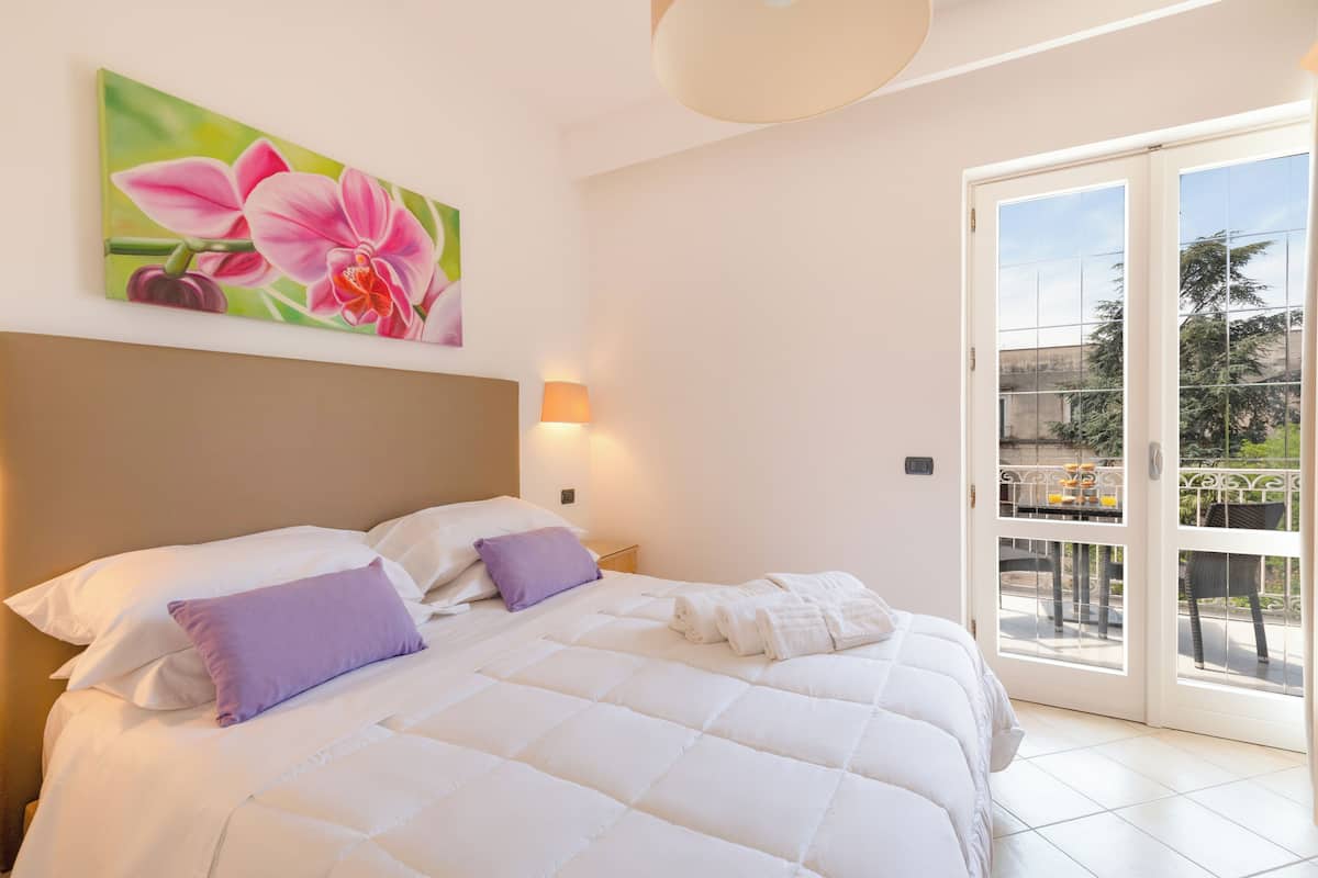 Double Room, Balcony, Garden View | In-room safe, blackout drapes, soundproofing, iron/ironing board