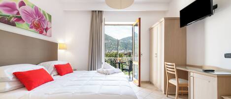 Deluxe Room, Balcony, Garden View | In-room safe, blackout drapes, soundproofing, iron/ironing board