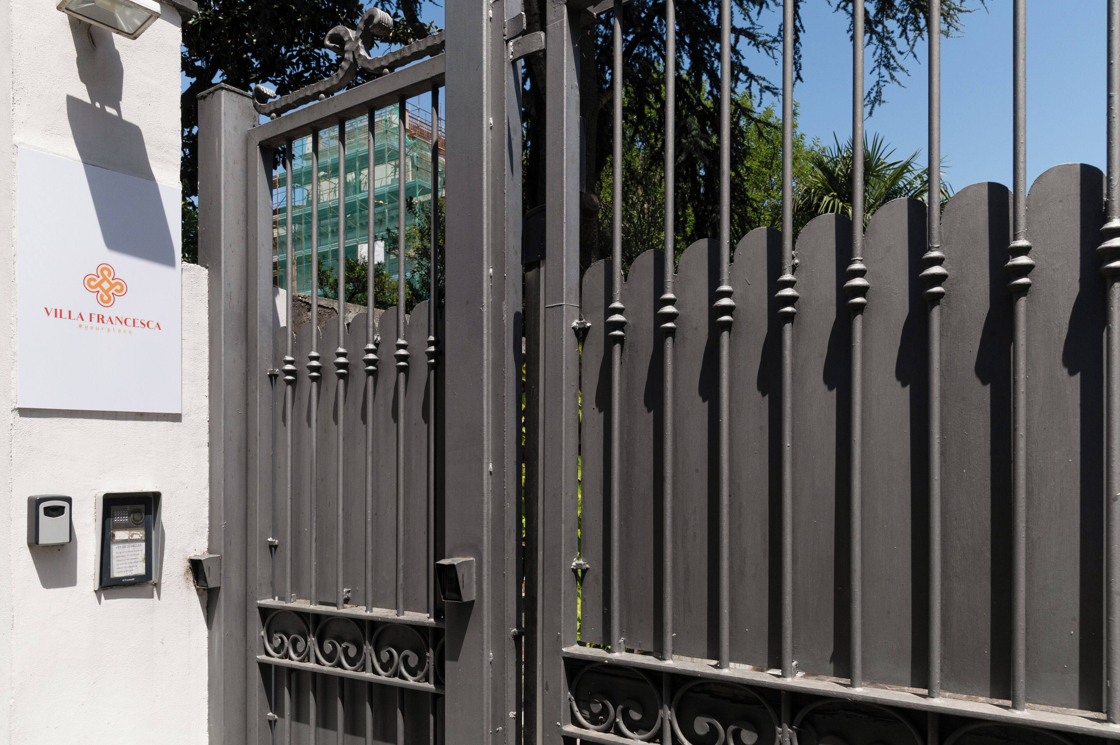 A gated entrance with a sign reading "Villa Francesca."