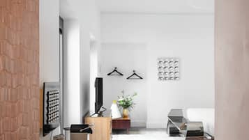 A modern living room with a fireplace, a coffee table, and a sofa.