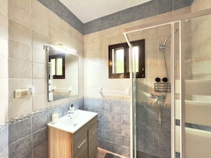 Shower, hair dryer, towels, toilet paper