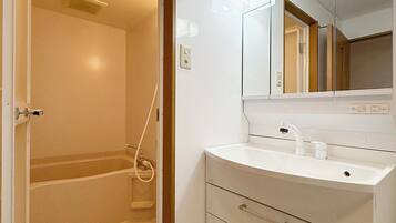 Standard Apartment, Balcony | Bathroom | Separate bathtub and shower, free toiletries, hair dryer, slippers