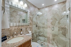 Shower, hair dryer, towels, shampoo