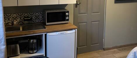 Fridge, microwave, electric kettle, toaster