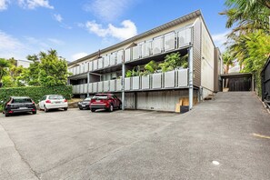 A multi-story parking garage with cars parked inside.