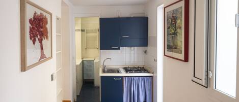 Fridge, coffee/tea maker, electric kettle, toaster