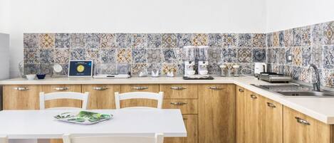 Fridge, stovetop, coffee/tea maker, cookware/dishes/utensils