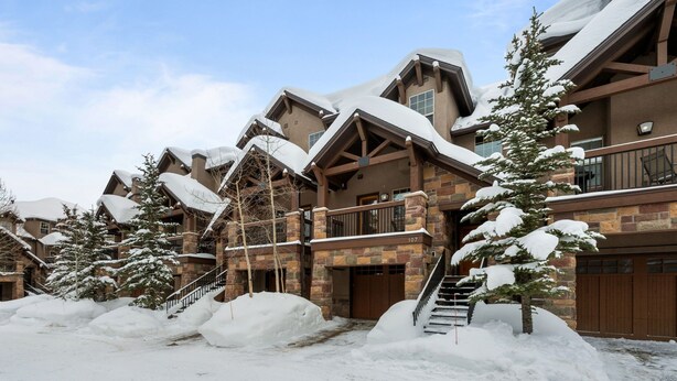 A snow-covered lodge with multiple balconies and a stone facade. - 3 Miles to Resort | Hot Tub | Fireplace | EV Charger | Great for Groups (Winter Park)
