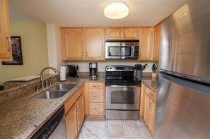 Condo, 2 Bedrooms | Private kitchen | Fridge, oven, coffee/tea maker, toaster