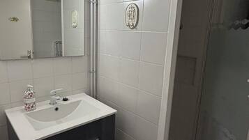 Shower, towels, soap, toilet paper