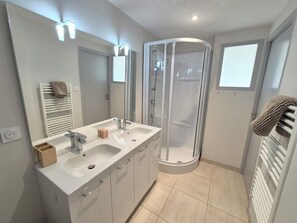 Shower, hair dryer, towels, soap