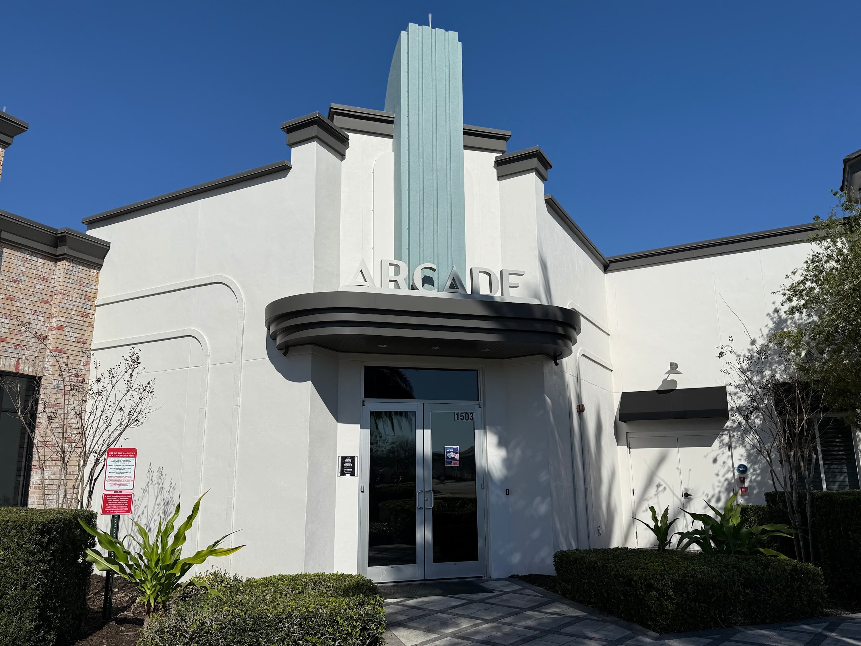 A building with a modern architectural style, featuring a prominent 'ARGADE' sign above the entrance.