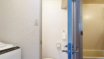Basic Apartment | Bathroom | Free toiletries, hair dryer, slippers, towels