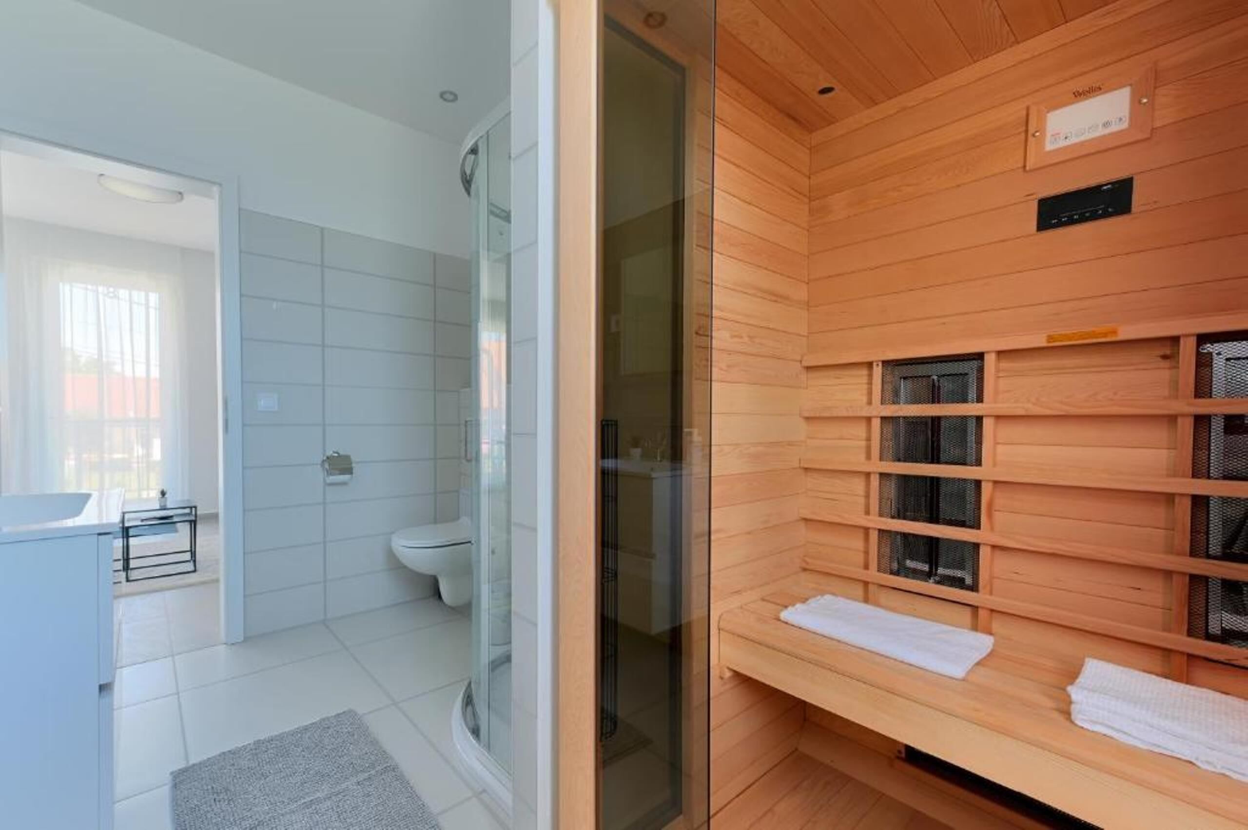 Shower, towels, soap, toilet paper