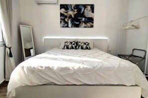 2 habitaciones, tabla de planchar con plancha, wifi y ropa de cama