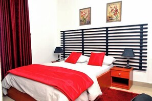 Deluxe Room, Balcony, City View | Desk, laptop workspace, blackout drapes, soundproofing