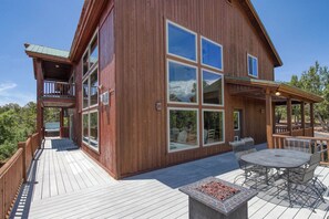 A large wooden house with a deck, outdoor seating, and large windows. - Best Views, Hot Tub, Game Room! 10 minutes to Zion (Orderville)