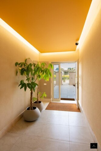 Air-conditioned apartment in greenery in a structure  swimming pool and E-bike