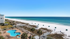A resort with a swimming pool, beach access, and a view of the ocean. - Drastic Reduction for Labor Day! Gulf front, updated, Pool, Hot Tub plus Gym. (Destin)