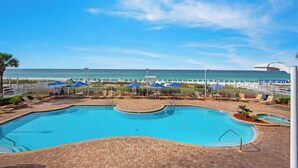 A swimming pool with a view of the beach and ocean. - Drastic Reduction for Labor Day! Gulf front, updated, Pool, Hot Tub plus Gym. (Destin)