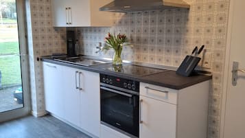 Fridge, stovetop, dishwasher, coffee/tea maker