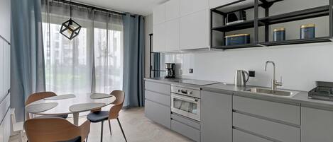 Classic Apartment, Courtyard View | Private kitchenette | Full-sized fridge, oven, stovetop, cookware/dishes/utensils