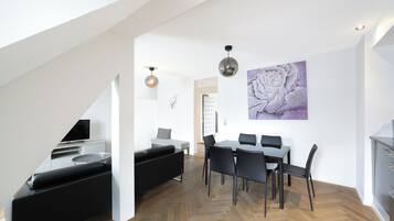 Two Bedroom Grand, Balcony, Kitchen -Standard | Living area | 32-inch flat-screen TV with cable channels