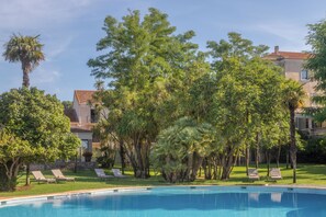 Indoor pool, seasonal outdoor pool, pool umbrellas, pool loungers