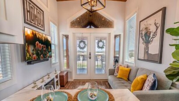A dining area with a marble table, two green placemats, and a woven placemat.