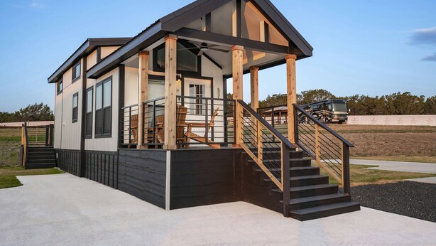 A modern two-story house with a covered porch, a staircase, and a garage. - Rinconcito Magico - 200 (Fredericksburg)