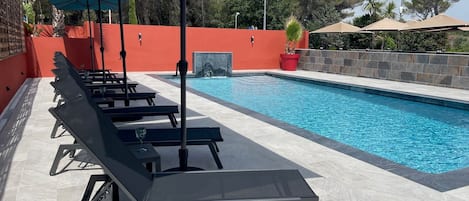 Seasonal outdoor pool, open 9:00 AM to 7:30 PM, pool umbrellas