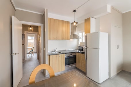 Penthouse, City View | Private kitchen | Microwave, oven, stovetop, coffee/tea maker
