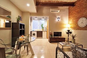 Deluxe Apartment, 1 Bedroom, Balcony, City View | Living area | 40-inch TV with digital channels - BeBarceloner Francesc Macia Apartments (Barcelona)