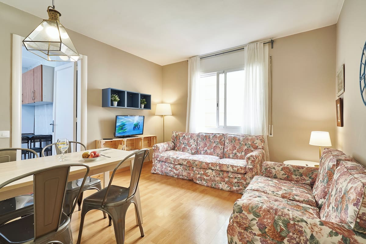 Apartment, 4 Bedrooms | Living area | 40-inch TV with digital channels