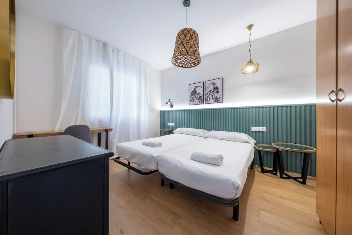Family Apartment, 4 Bedrooms | 4 bedrooms, desk, iron/ironing board, cots/infant beds