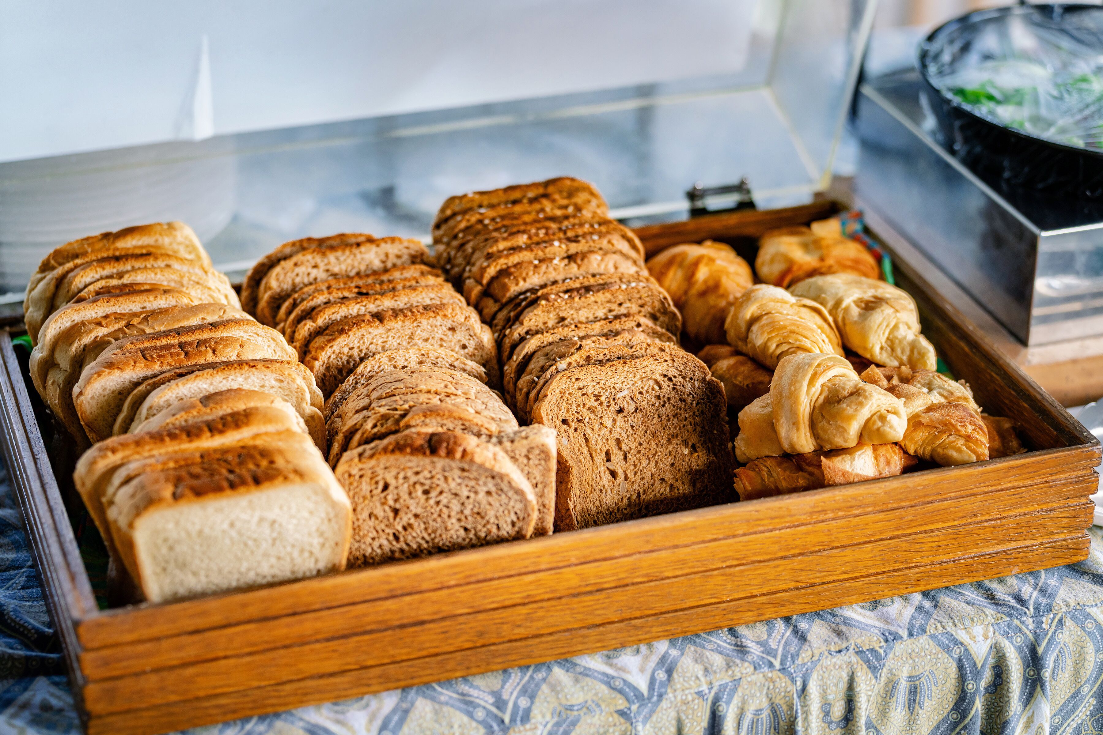 A tray of assorted breads and pastries.