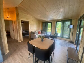 Living area - Favourite Lodge with Hot Tub at Kingfisher Lakes | Panoramic Views | Sunny Deck! (Brandesburton)
