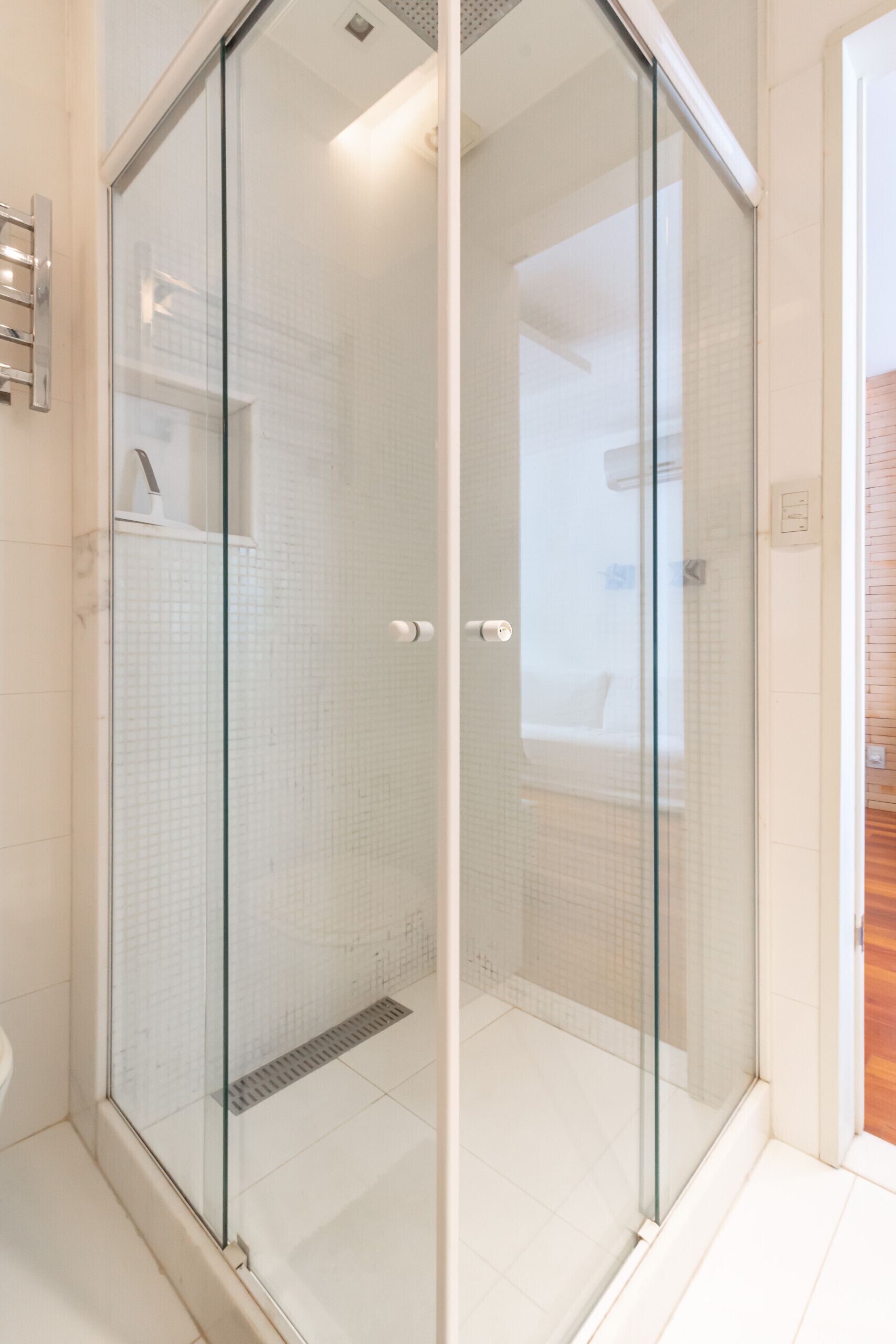 Shower, hair dryer, towels, shampoo