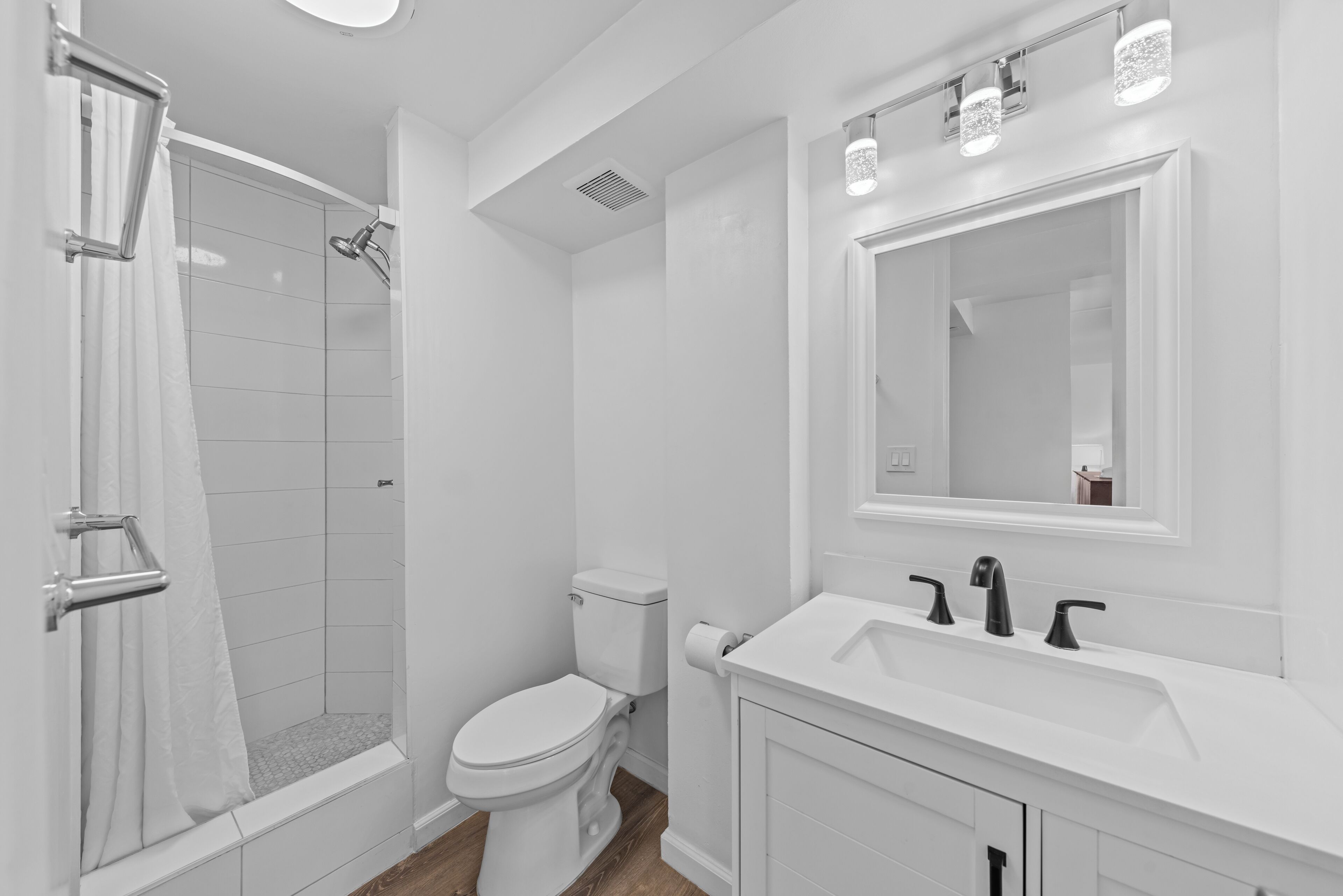 Shower, hair dryer, towels, toilet paper