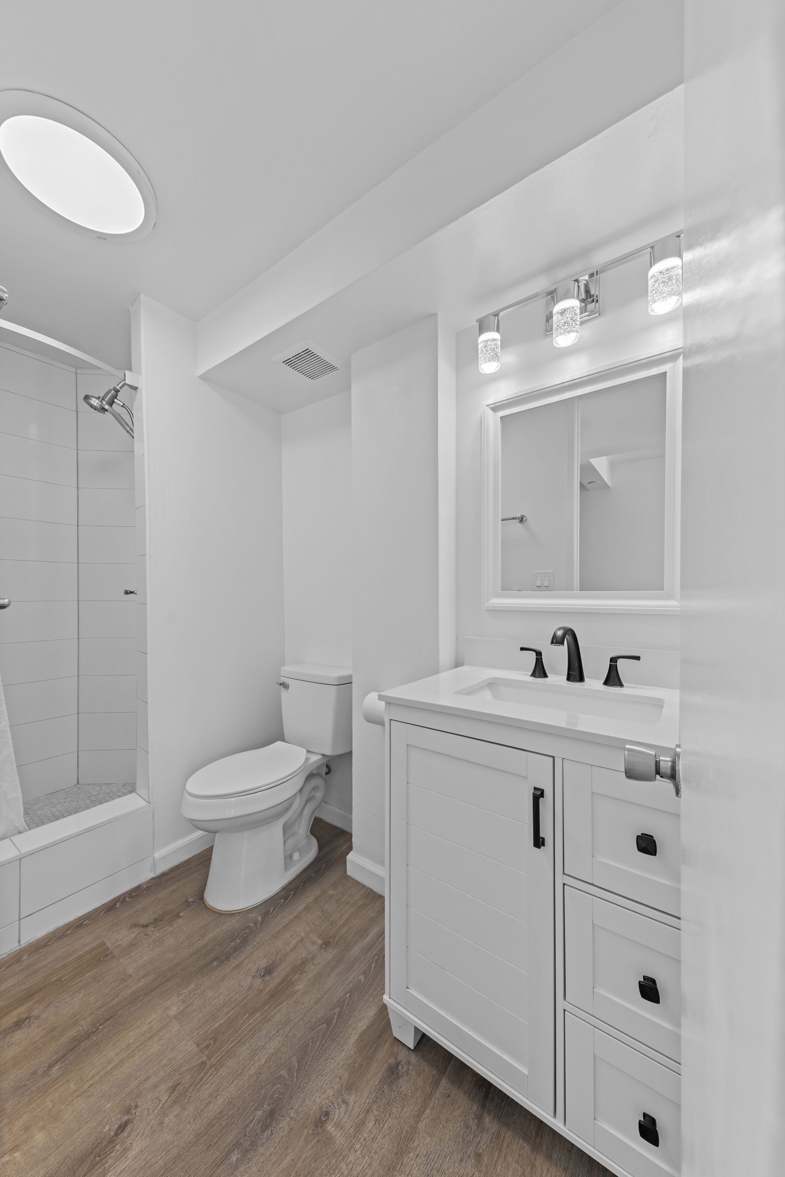 Shower, hair dryer, towels, toilet paper