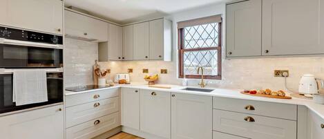 Oven, dishwasher, high chair, cookware/dishes/utensils