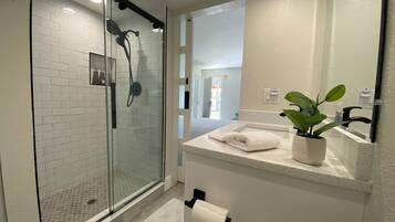 Shower, hair dryer, towels, soap