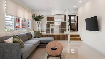 Luxury Studio Suite, Kitchen, City View | Living area | 42-inch TV with satellite channels