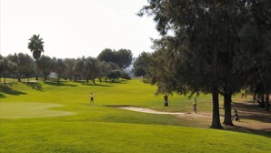 A golf course with a well-maintained fairway, sand bunkers, and a variety of trees. - 6 Guests - Private Pool - 3Br Villa - Amazing View (Orba)