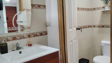 Bidet, towels, soap, shampoo