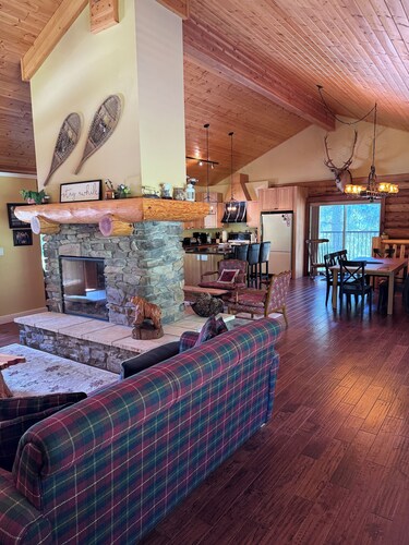 Experience the warmth of our gorgeous log home backing onto the first fairway.